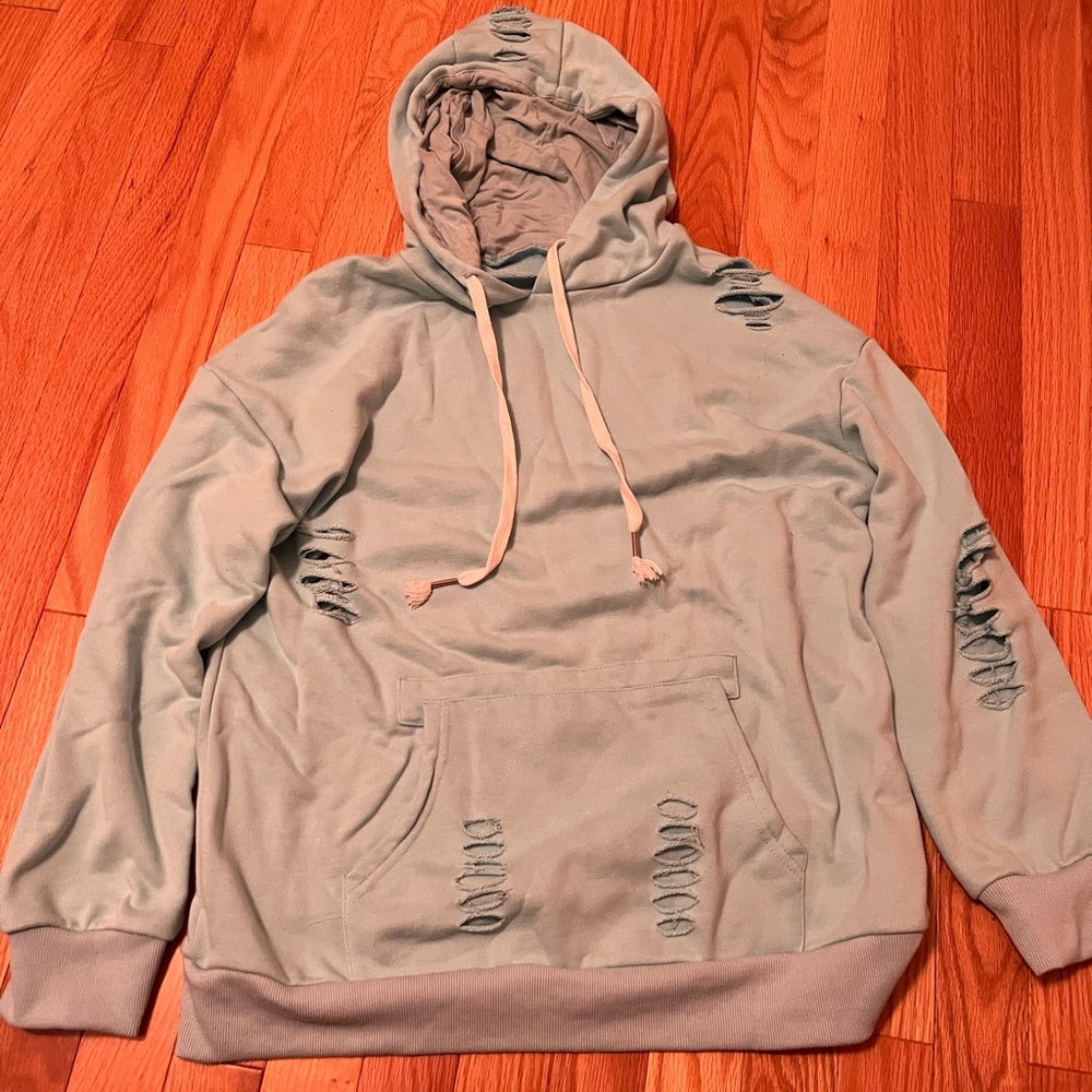 Unique unbranded distressed teal hoodie. Women’s size small. Super cute!!